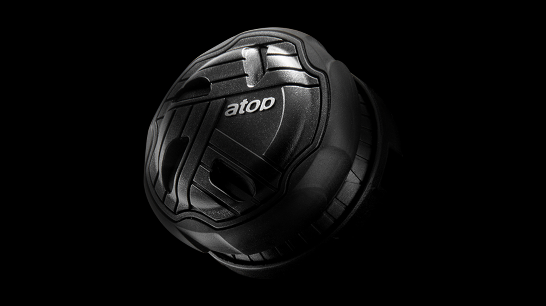 Black spherical object with 'atop' branding on a black background