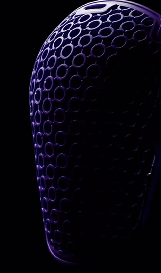 Close-up of a textured purple object on a black background