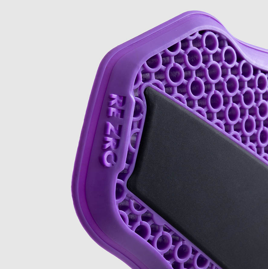 Purple textured mat with 'REZRO' branding on a light gray background